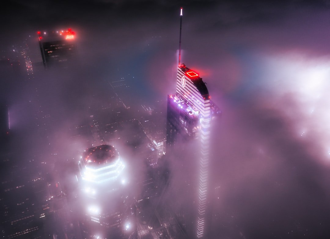 Futuristic spaceship from Star Atlas game flying through a colorful nebula in space